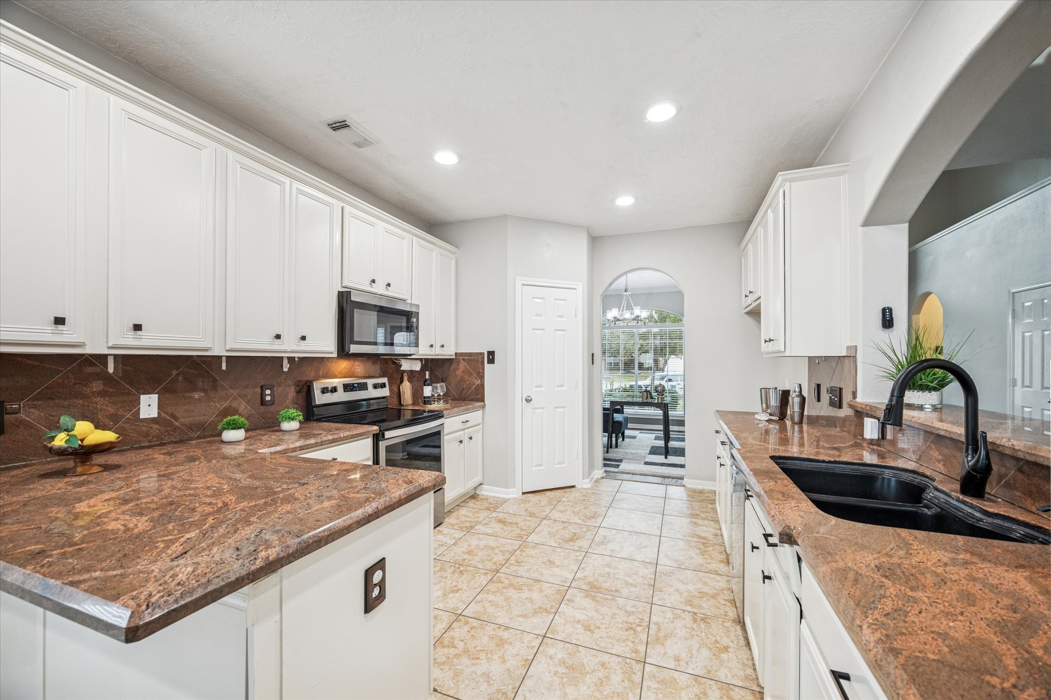 7243 Emerald Run Lane Spring, TX 77379 - Photo 15 of 35 a kitchen with counter top space cabinets and stainless steel appliances