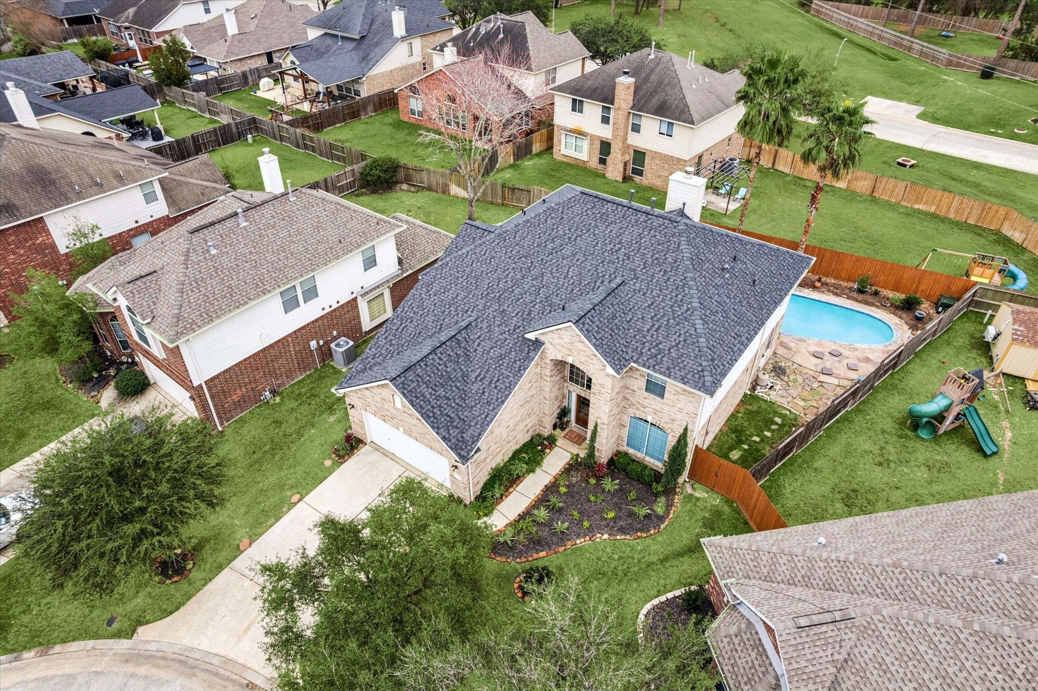 7243 Emerald Run Lane Spring, TX 77379 - Photo 2 of 35 an aerial view of multiple houses with yard