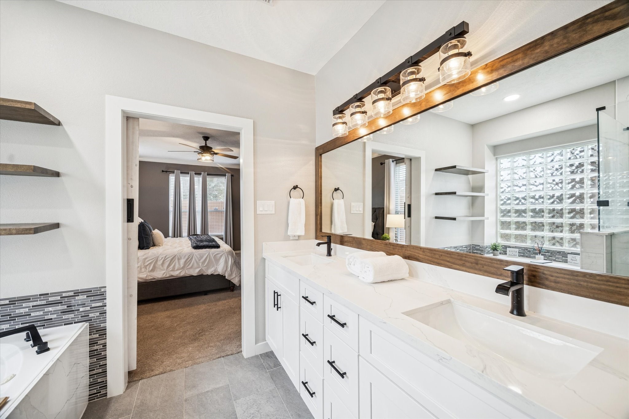 7243 Emerald Run Lane Spring, TX 77379 - Photo 22 of 35 a spacious bedroom with a bed and a large window