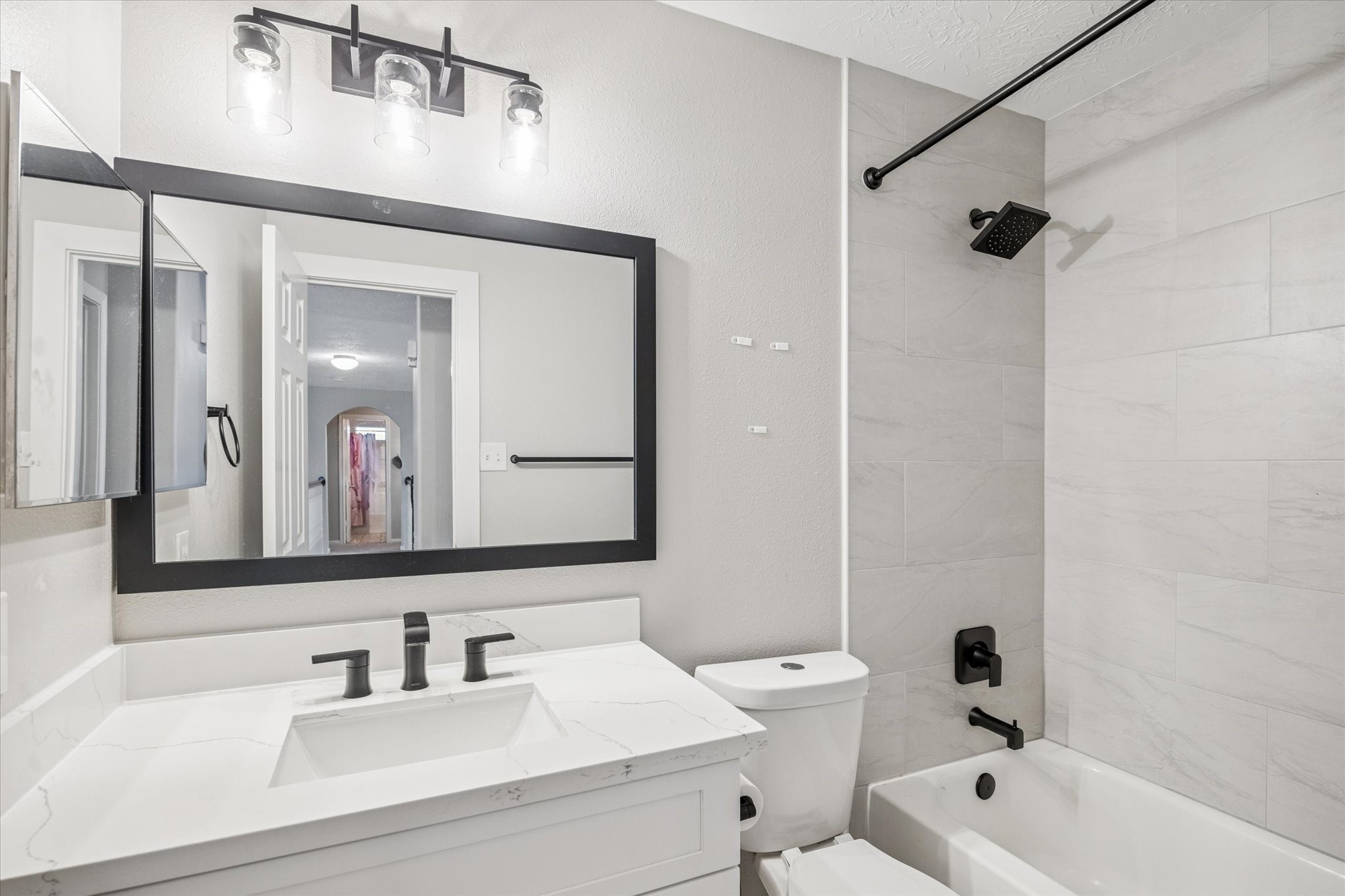 7243 Emerald Run Lane Spring, TX 77379 - Photo 28 of 35 a bathroom with a bathtub shower sink vanity and mirror