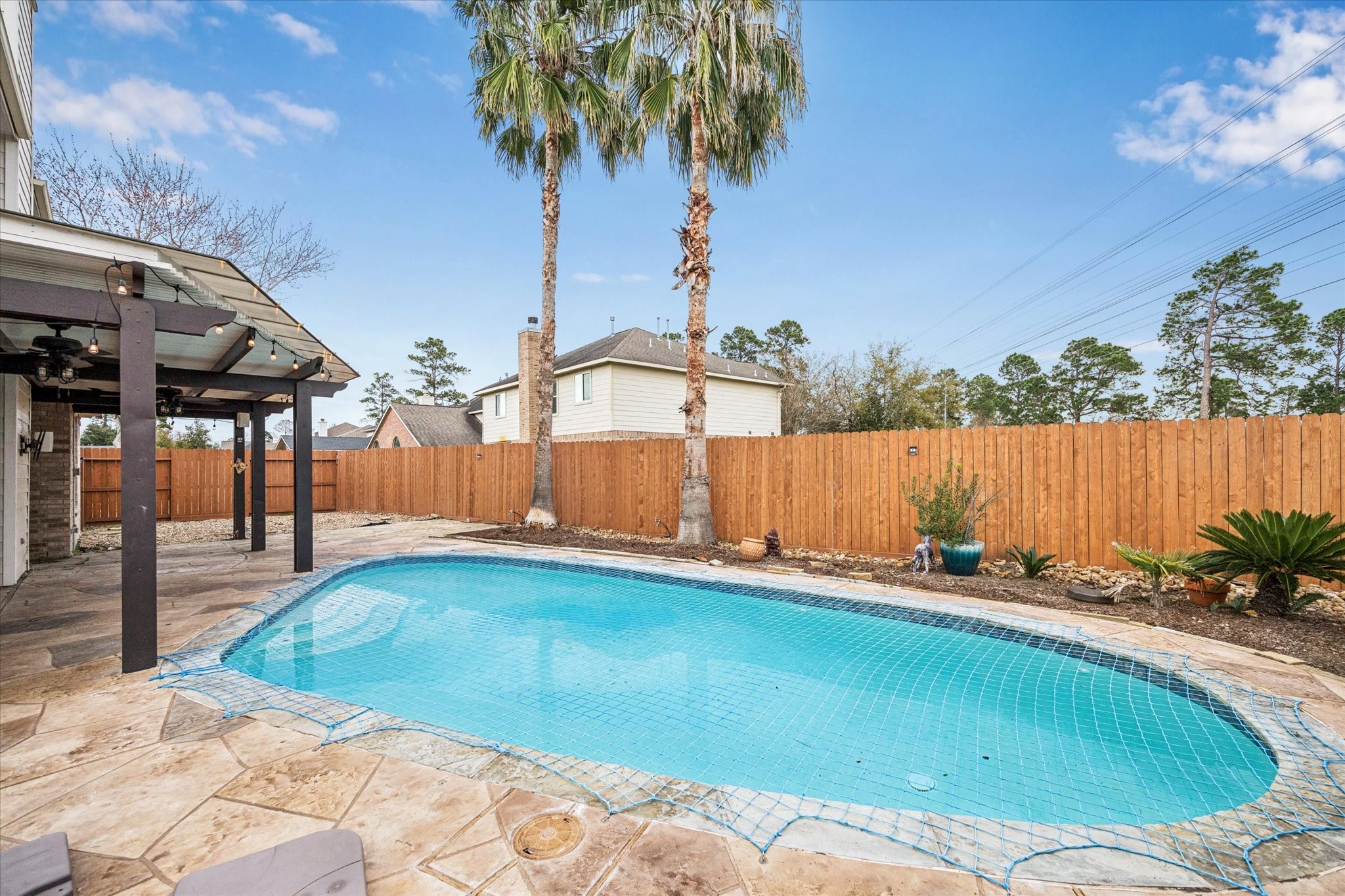 7243 Emerald Run Lane Spring, TX 77379 - Photo 32 of 35 a backyard of a house with table and chairs