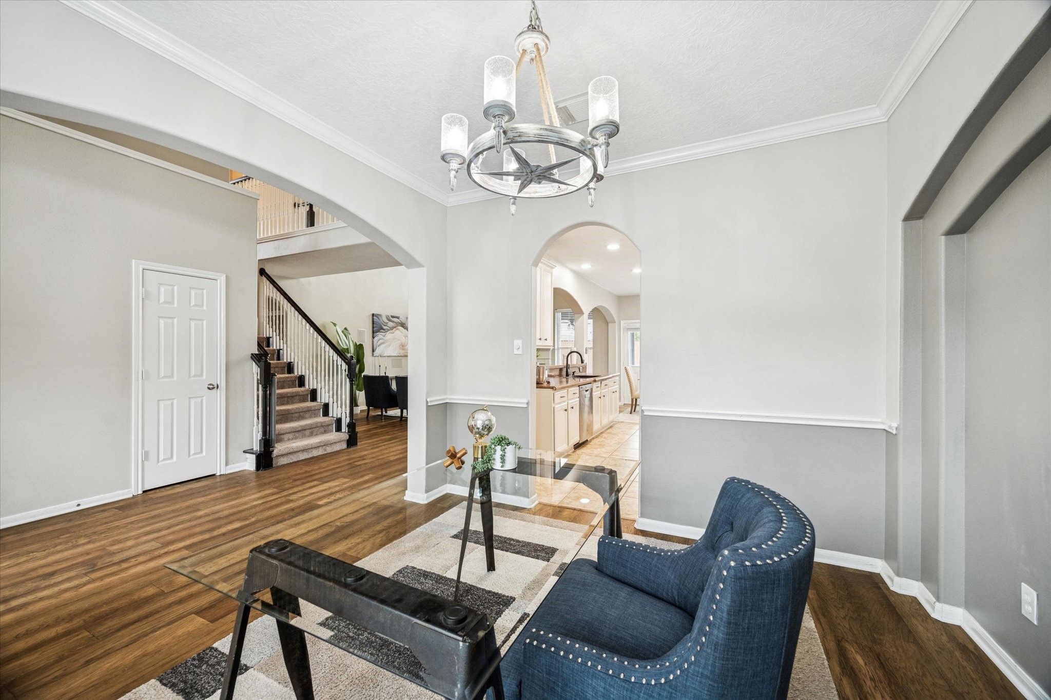 7243 Emerald Run Lane Spring, TX 77379 - Photo 9 of 35 a view of a livingroom and dining room with wooden floor