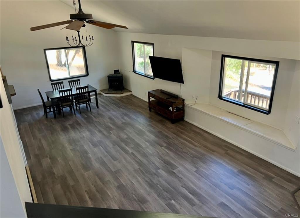 3568 Manzanita Road Mariposa, CA 95338 - Photo 16 of 17 a living room with furniture and a flat screen tv