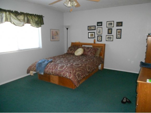 3260 West Ron Road, Unit 2 Paulden, AZ 86334 - Photo 6 of 17 a bedroom with a bed and a window