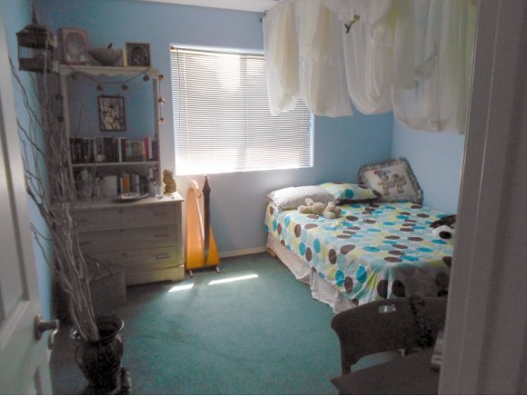 3260 West Ron Road, Unit 2 Paulden, AZ 86334 - Photo 9 of 17 a bedroom with a bed table and a window