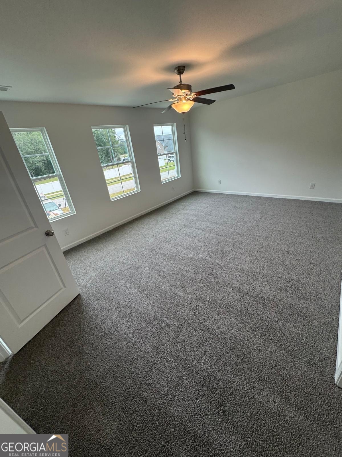 435 Wilkins Road Midway, GA 31320 - Photo 11 of 22 an empty room with windows