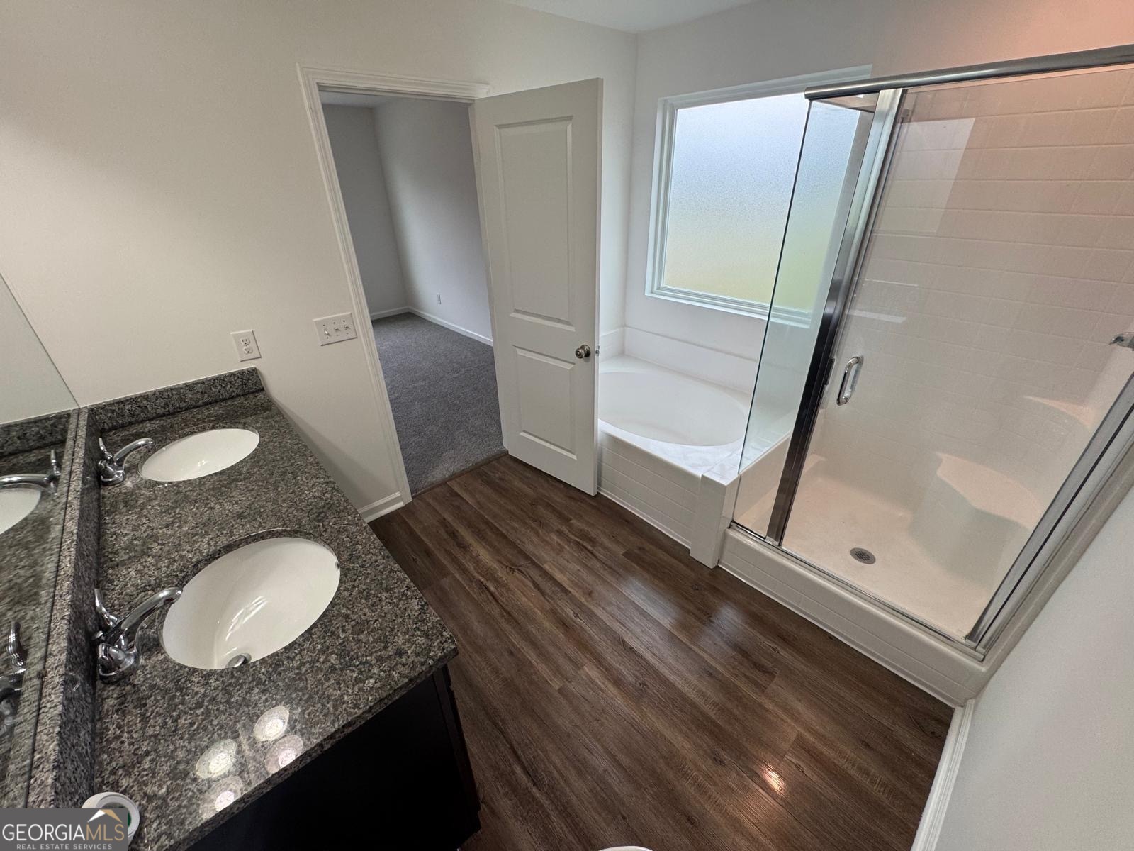 435 Wilkins Road Midway, GA 31320 - Photo 14 of 22 a bathroom with a granite countertop sink toilet and shower