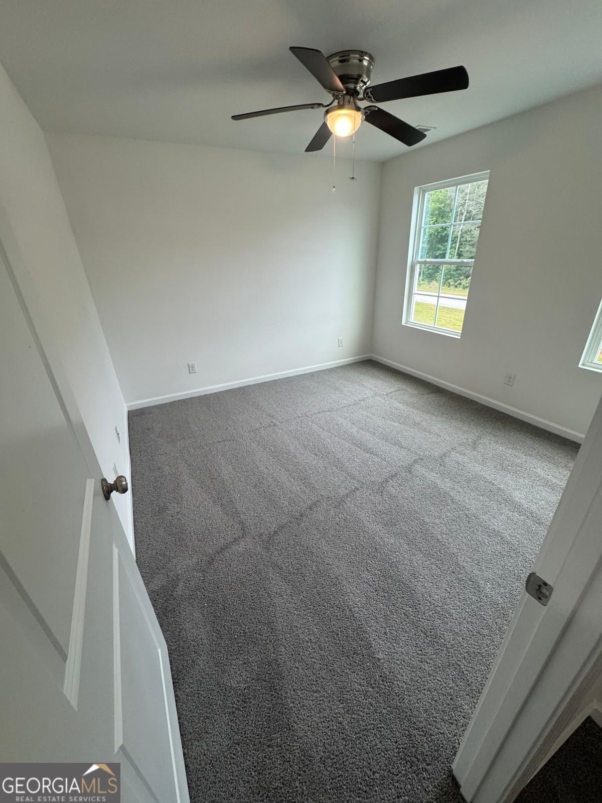 435 Wilkins Road Midway, GA 31320 - Photo 15 of 22 a view of empty room with windows