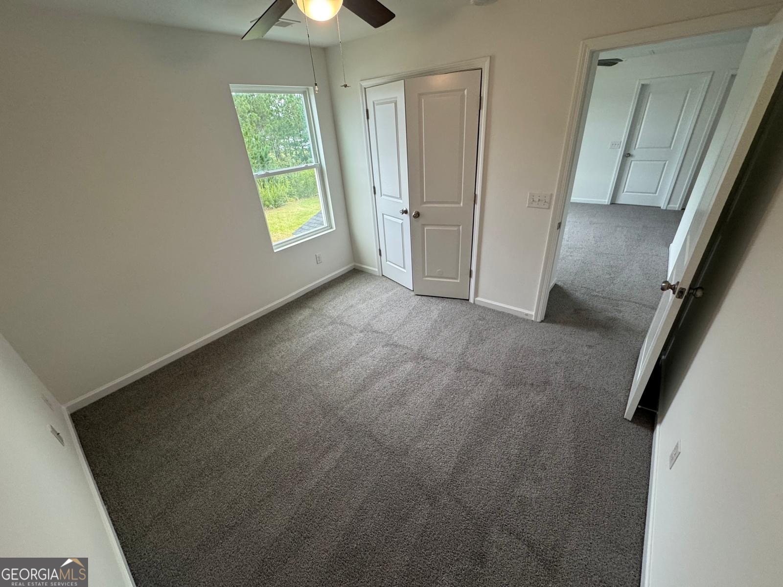 435 Wilkins Road Midway, GA 31320 - Photo 17 of 22 a view of an empty room with a window