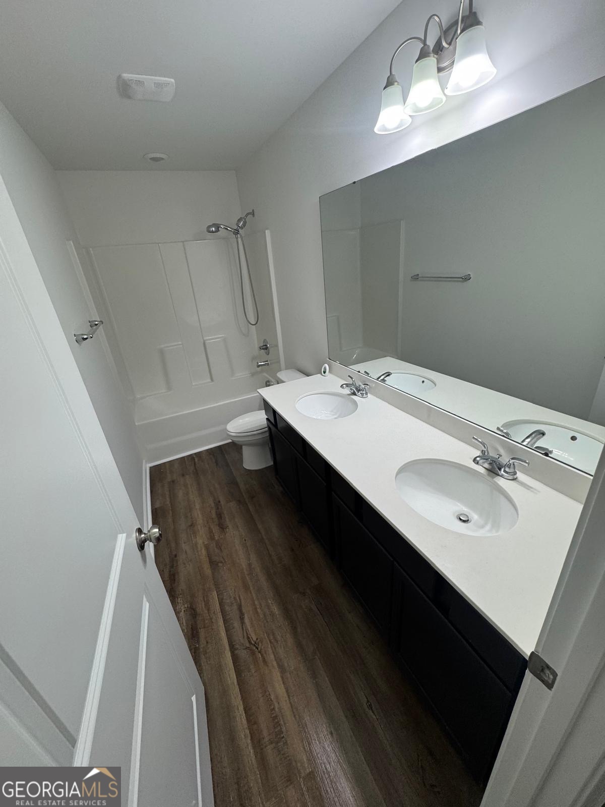 435 Wilkins Road Midway, GA 31320 - Photo 19 of 22 a bathroom with a sink a mirror and a toilet