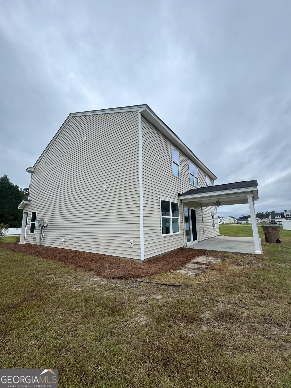 435 Wilkins Road Midway, GA 31320 - Photo 22 of 22 a view of a house with a backyard
