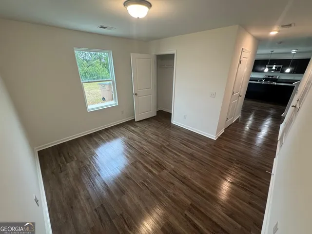an entryway with wooden floor