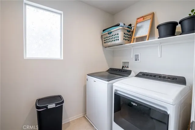 a bed room with a bed and a window