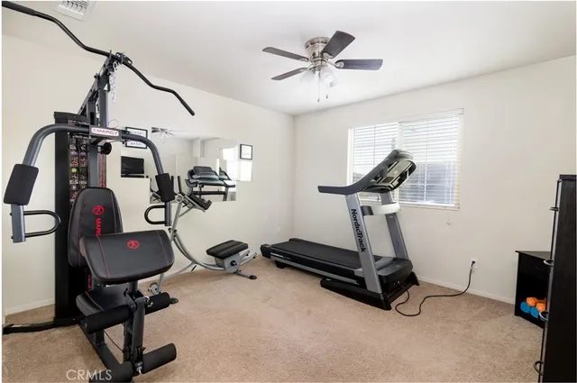 a bathroom with a toilet and a shower curtain