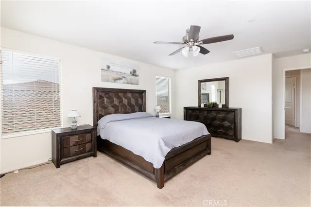 a bed room with a bed and a television