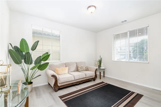 a room with furniture and wooden floor