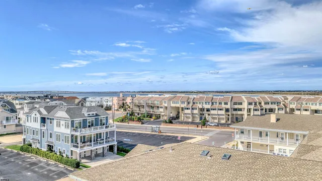 a view of a swimming pool with outdoor seating