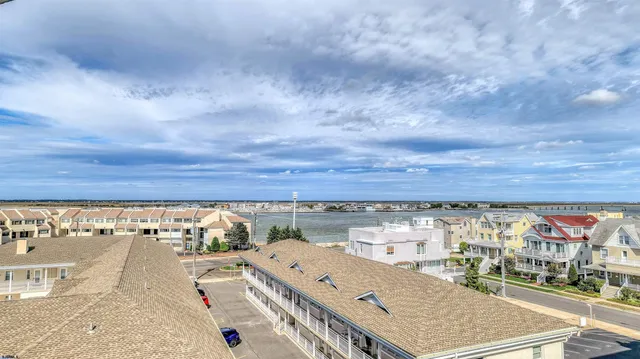a view of a building with a swimming pool