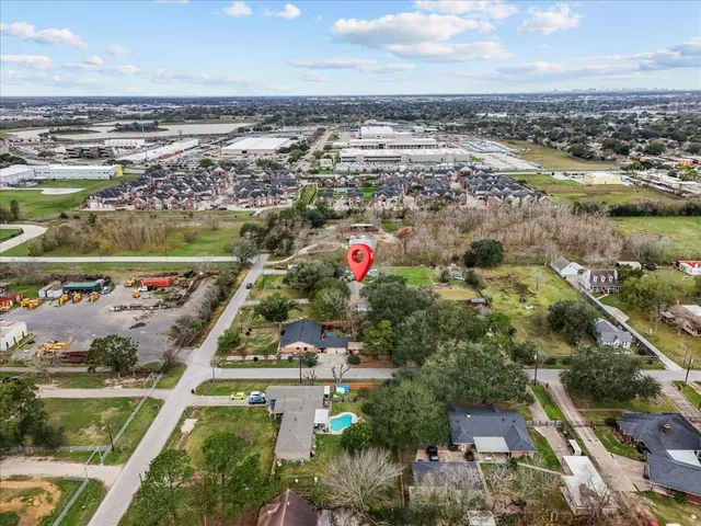 an aerial view of residential houses with outdoor space