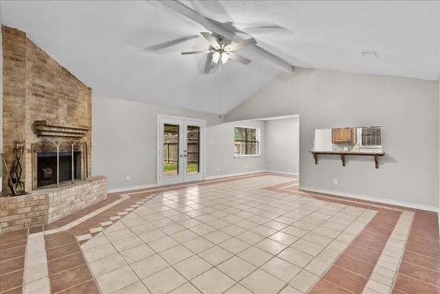a view of a livingroom with a ceiling fan and window
