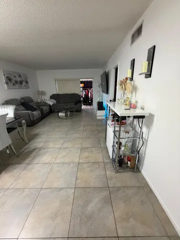 an empty room with large window