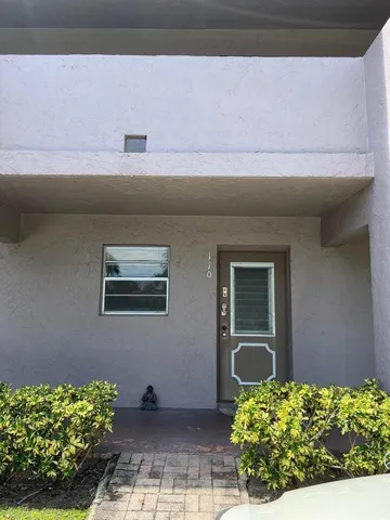 a view of room with ceiling fan and window