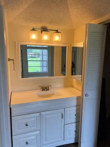 a view of a lake with a garden