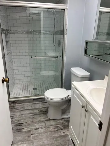 a view of hallway with windows and stairs