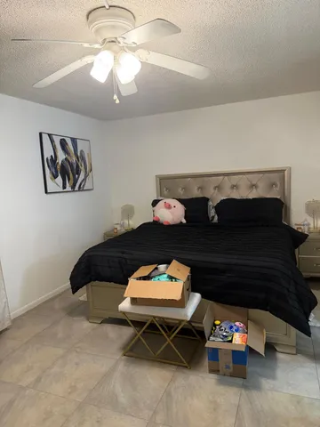 a view of yard with swimming pool and trees in the background