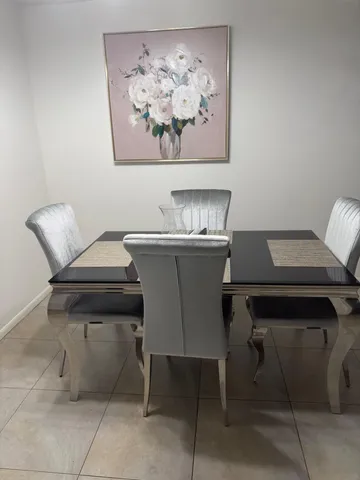 a view of a dining room with furniture and wooden floor