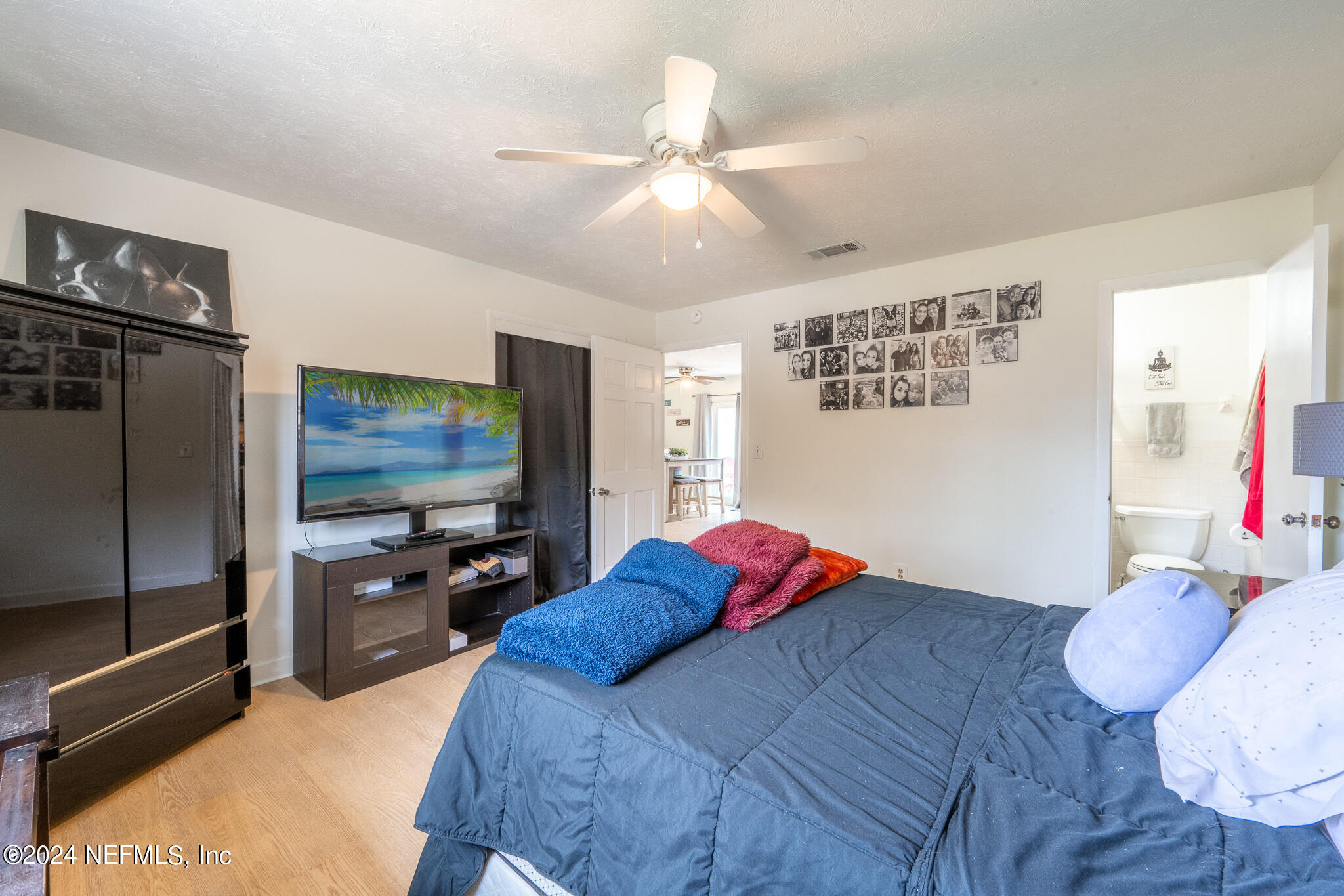 301 Penman Road Neptune Beach, FL 32266 - Photo 14 of 31 a bedroom with a bed and a flat screen tv