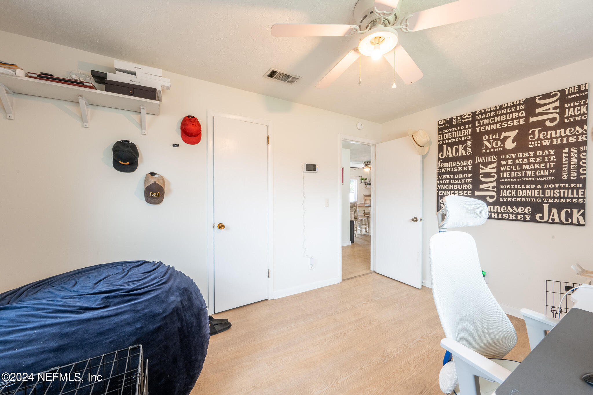 301 Penman Road Neptune Beach, FL 32266 - Photo 18 of 31 a bedroom with a bed and a chandelier