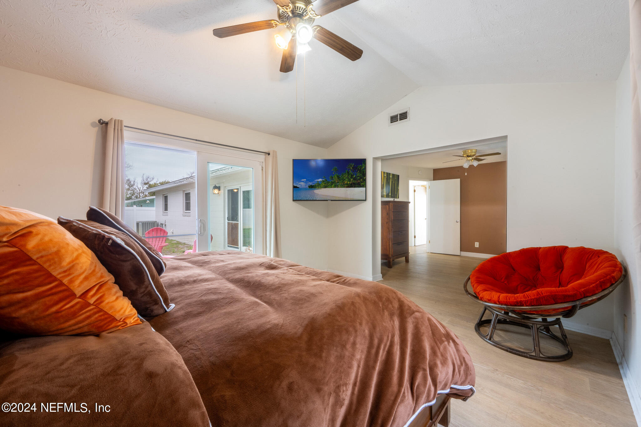 301 Penman Road Neptune Beach, FL 32266 - Photo 22 of 31 a bed room with a bed and a chair