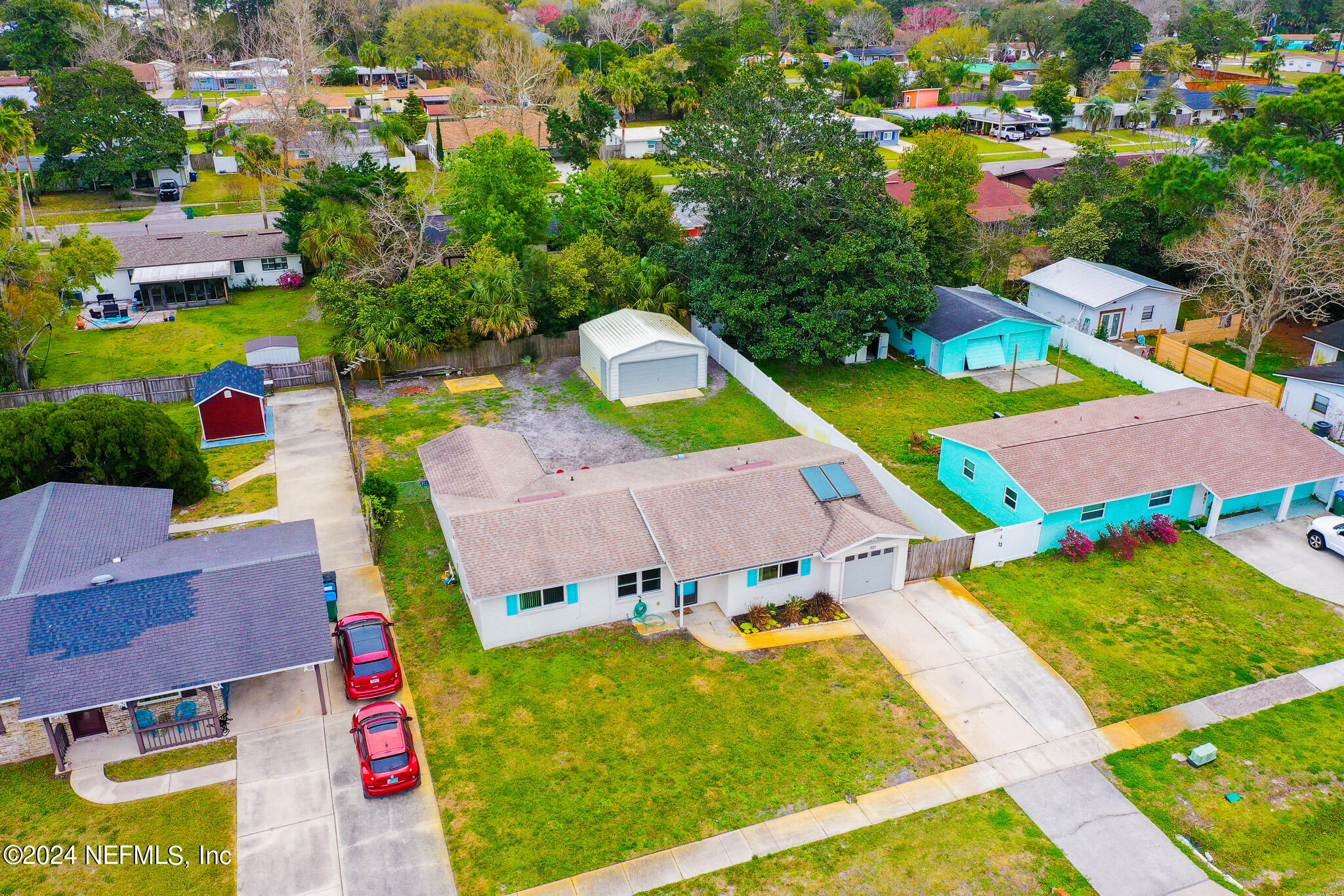 301 Penman Road Neptune Beach, FL 32266 - Photo 27 of 31 an aerial view of residential houses with outdoor space and swimming pool