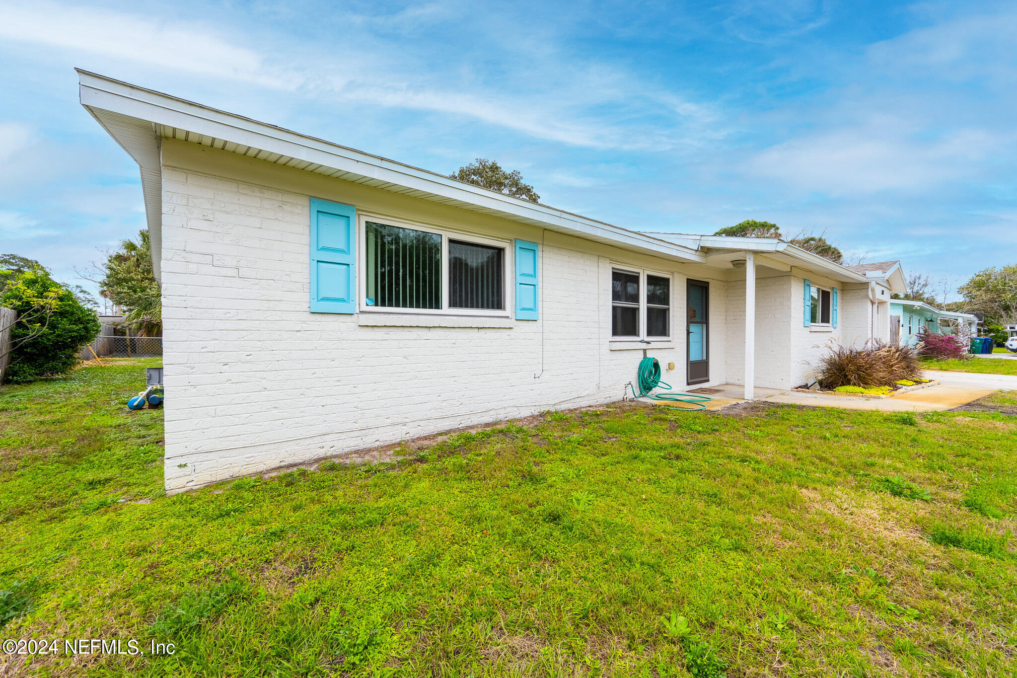 301 Penman Road Neptune Beach, FL 32266 - Photo 3 of 31 a view of a house with a backyard
