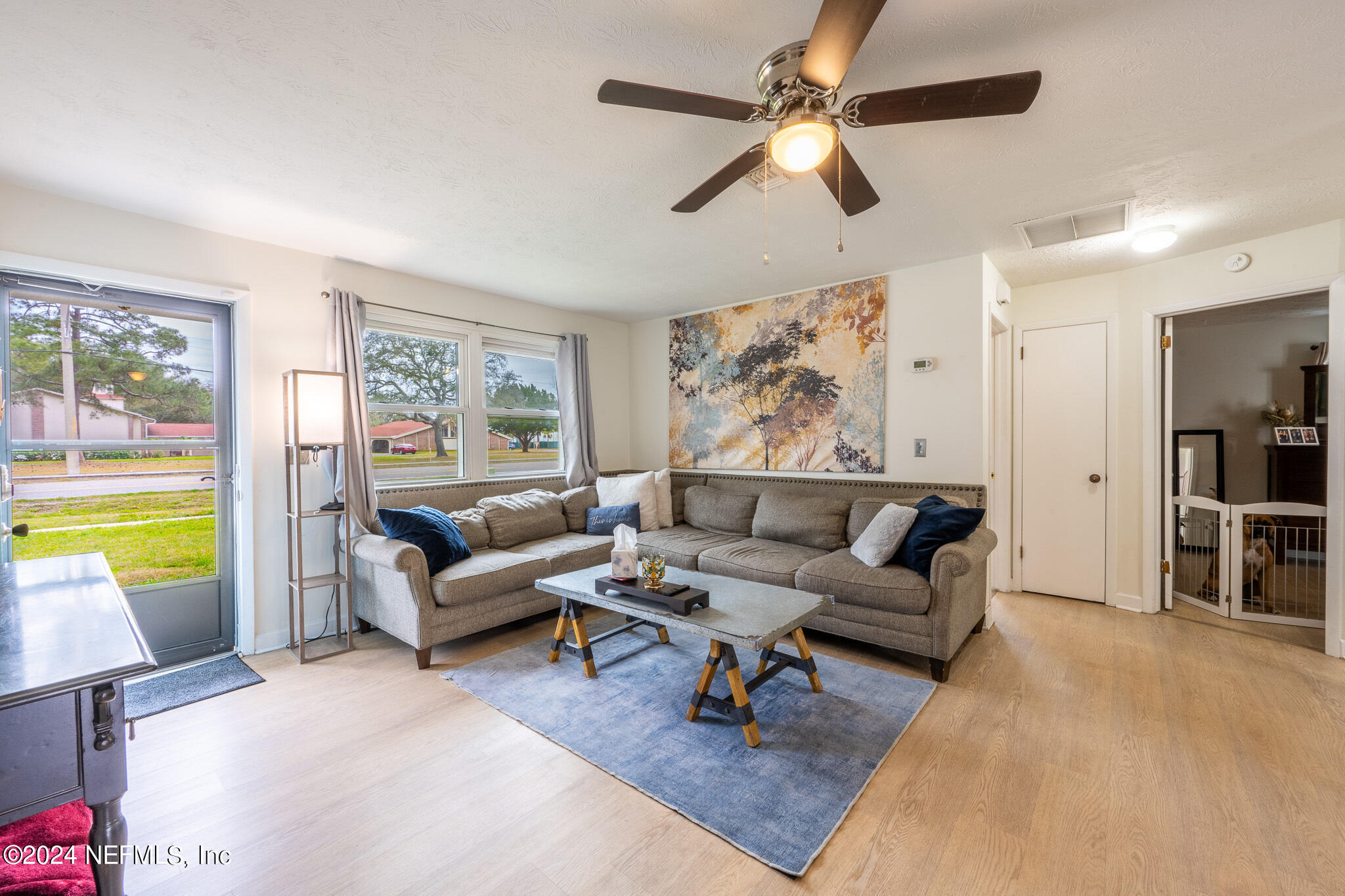 301 Penman Road Neptune Beach, FL 32266 - Photo 6 of 31 a living room with furniture and a large window