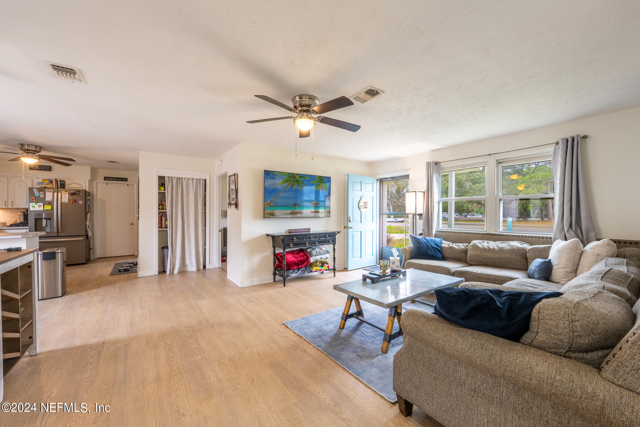 301 Penman Road Neptune Beach, FL 32266 - Photo 7 of 31 a living room with furniture and a large window