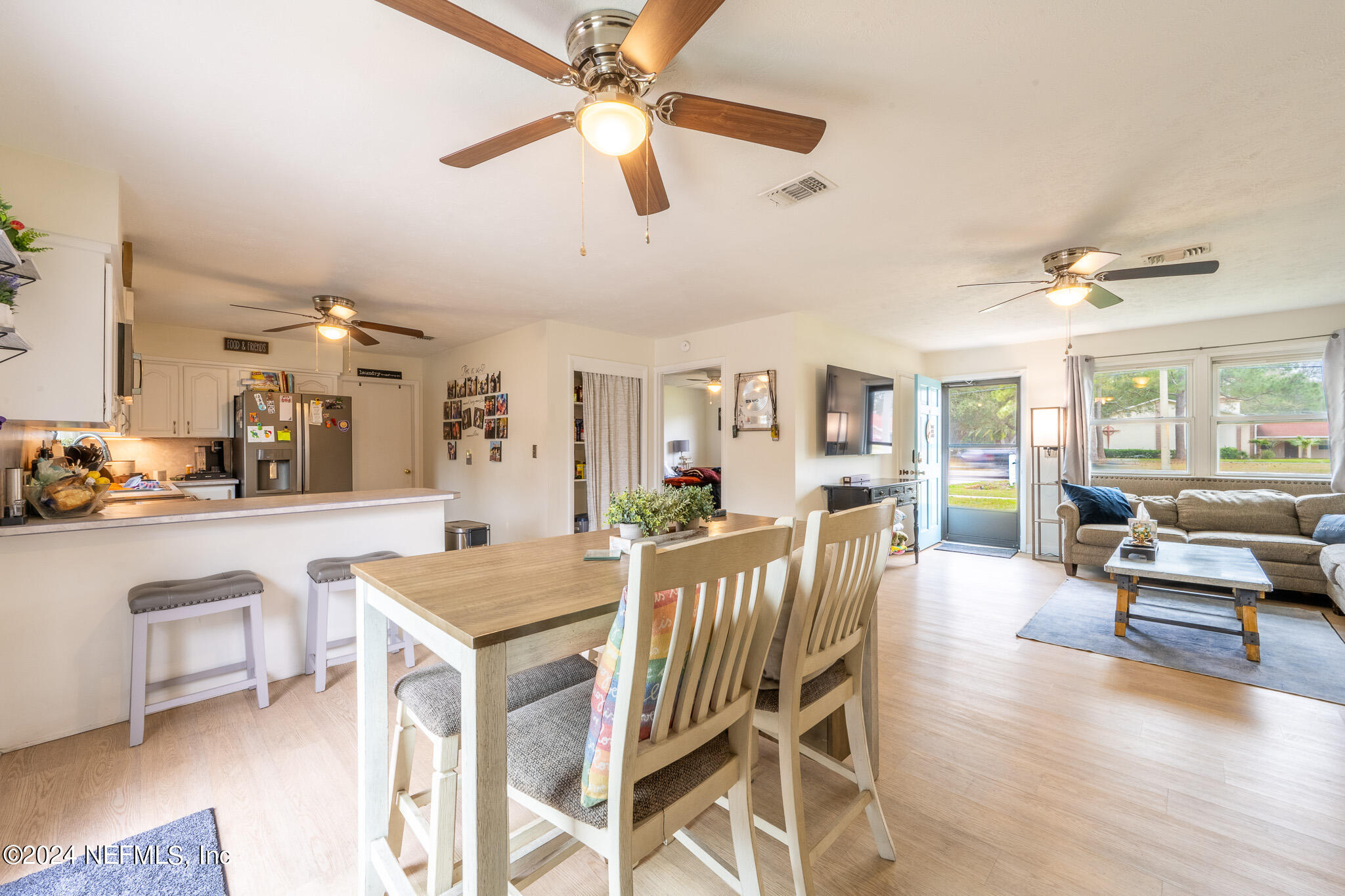 301 Penman Road Neptune Beach, FL 32266 - Photo 9 of 31 a view of a dining room with furniture window and wooden floor