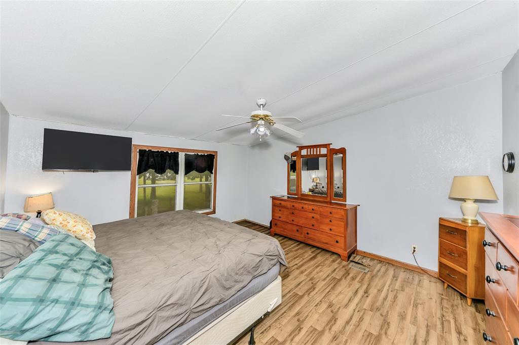 228 Slayden Road Sunset, TX 76270 - Photo 11 of 23 Primary bedroom with ensuite bath.