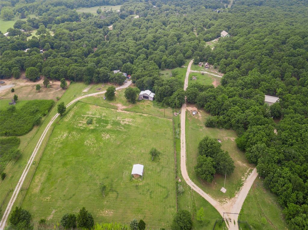 228 Slayden Road Sunset, TX 76270 - Photo 18 of 23 Your driveway is to the left in this aerial photo. Fence lines go straight back into the woods.