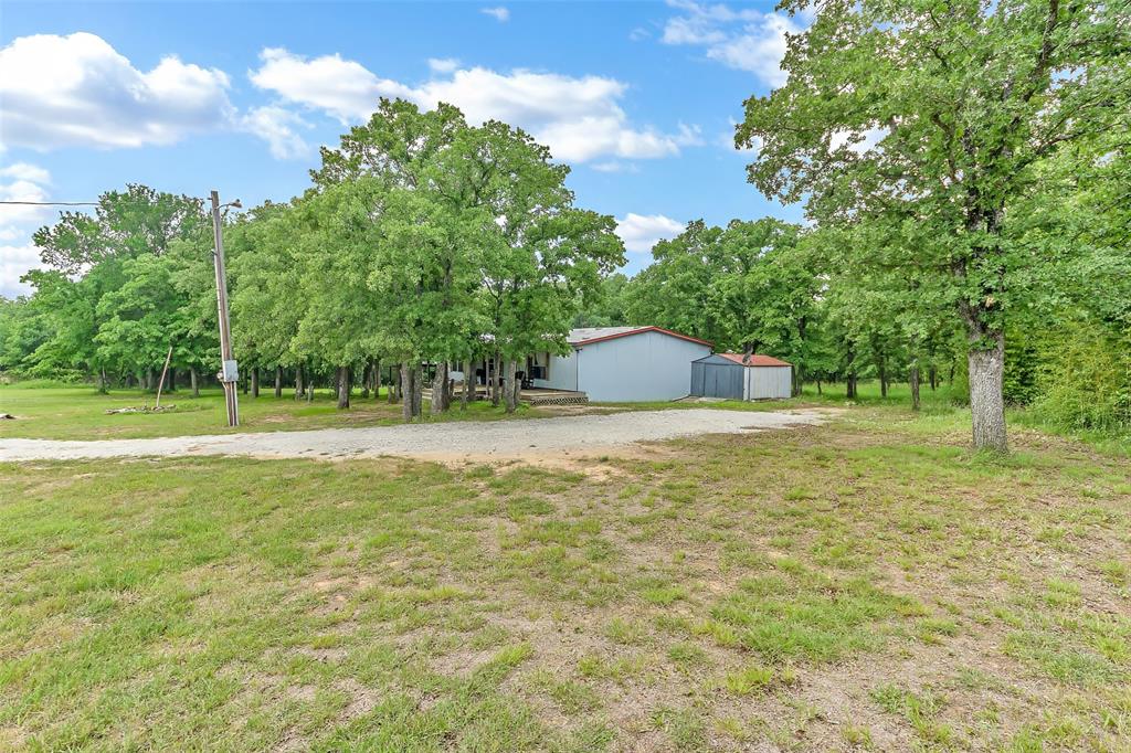 228 Slayden Road Sunset, TX 76270 - Photo 2 of 23 Large yard leading to pasture.