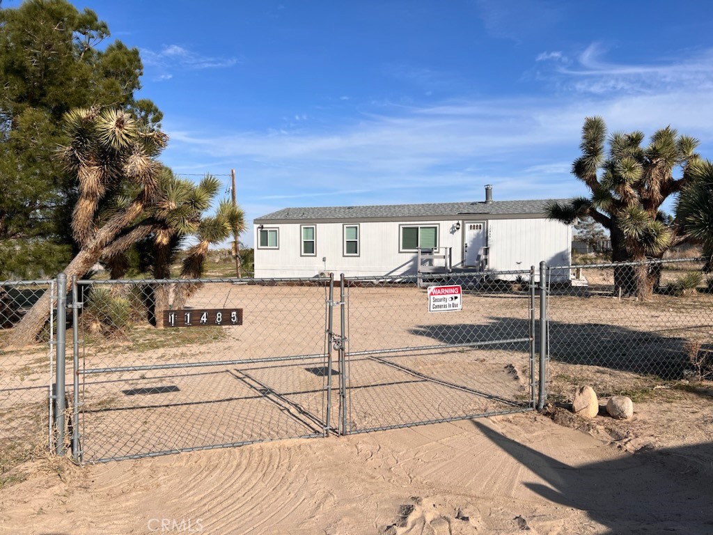 11485 Eaby Road Phelan, CA 92371 - Photo 1 of 1 a view of a patio with a road