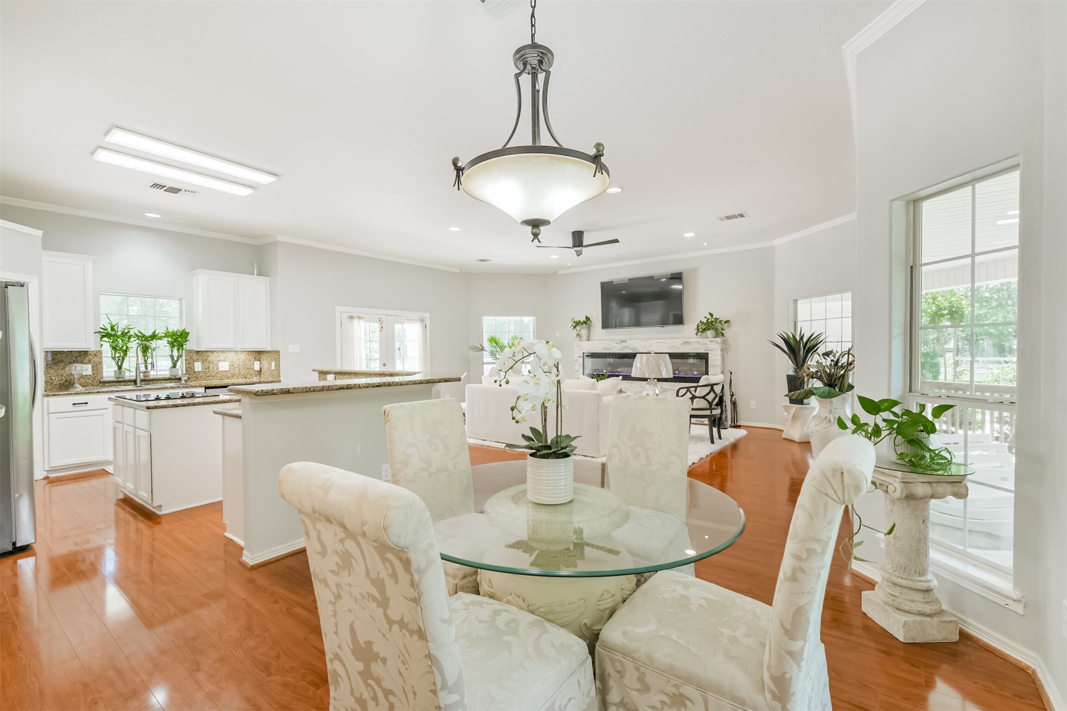 6002 Ranch Park Road Magnolia, TX 77354 - Photo 13 of 49 The Dining area flows into the living room offering plenty of natural light and a view of the outdoors.