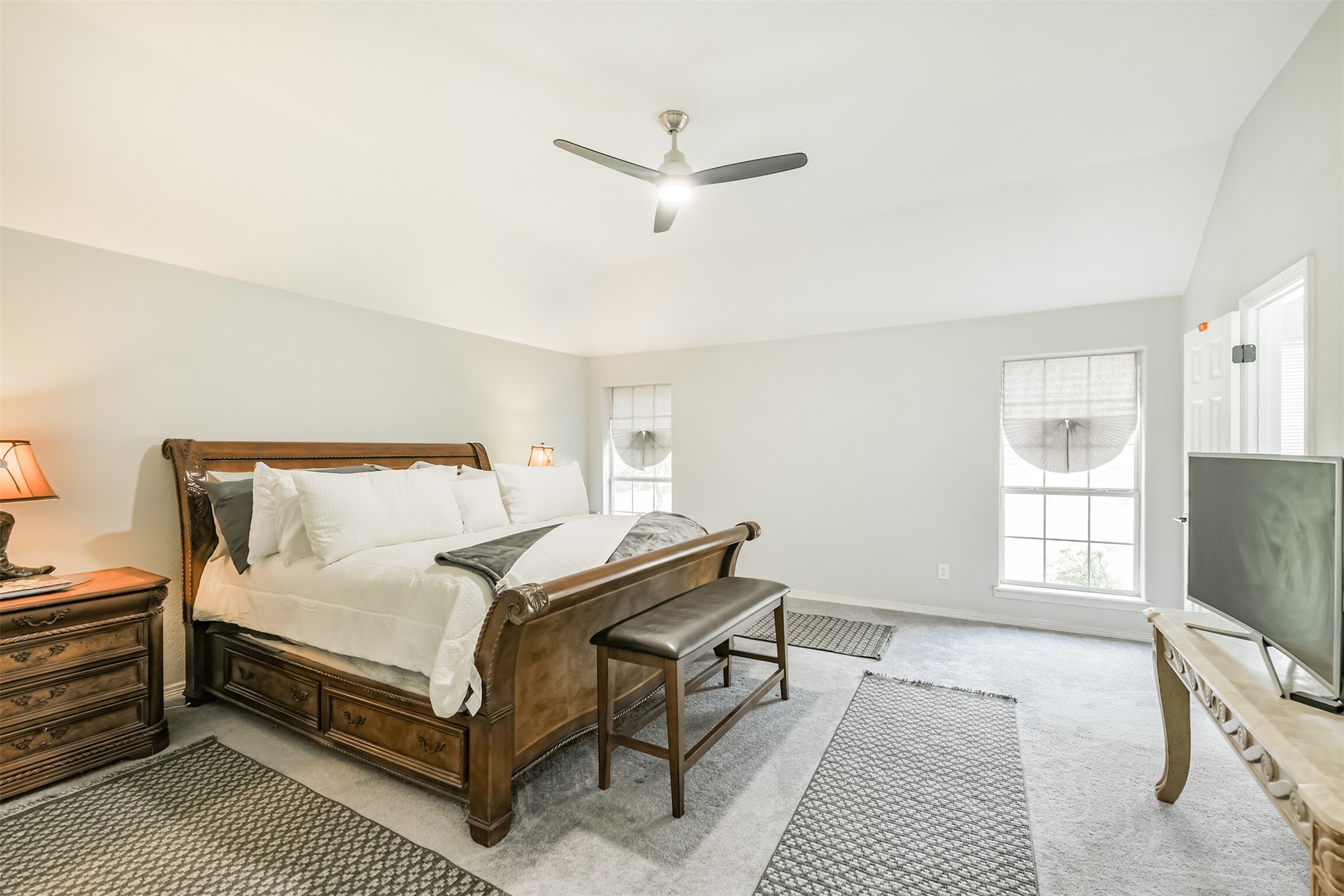 6002 Ranch Park Road Magnolia, TX 77354 - Photo 16 of 49 Spacious and bright Primary bedroom featuring a High ceiling, large windows, and neutral decor.