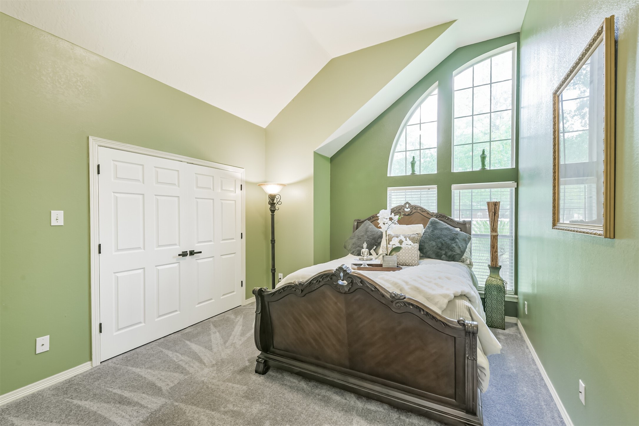 6002 Ranch Park Road Magnolia, TX 77354 - Photo 23 of 49 The third features a high vaulted ceiling and large arched windows, allowing plenty of natural light.