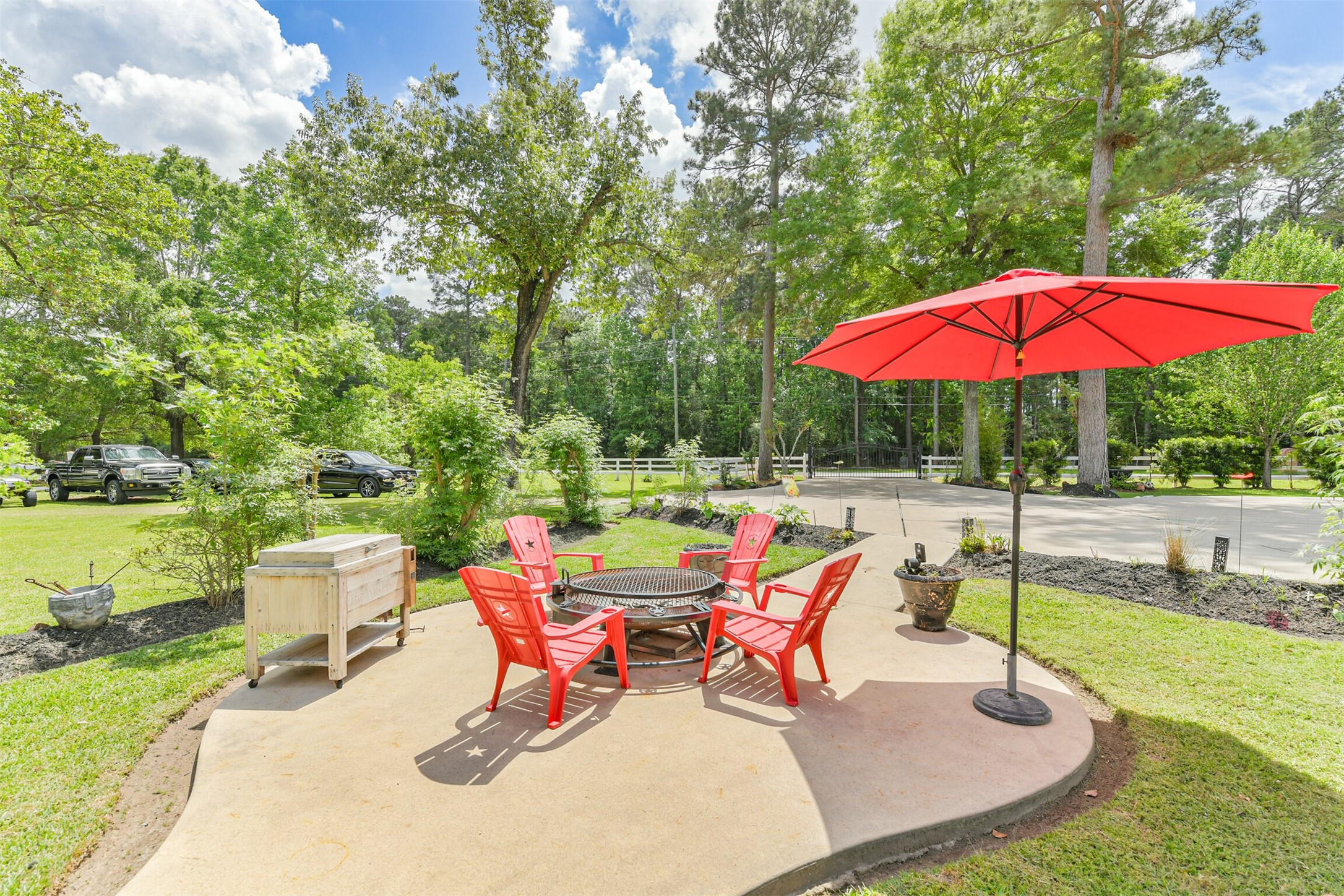6002 Ranch Park Road Magnolia, TX 77354 - Photo 34 of 49 View of the gate and luscious back yard w/ Fruit trees, and Vegetable, a gardener's dream