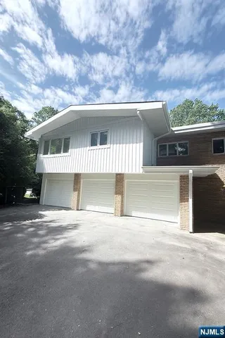 a front view of a house with a garage