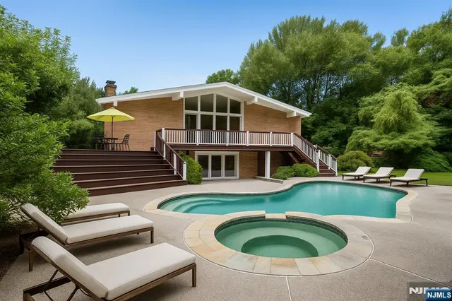 a front view of a house with swimming pool