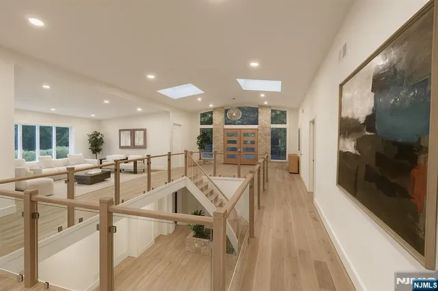 a view of a kitchen with furniture and wooden floor