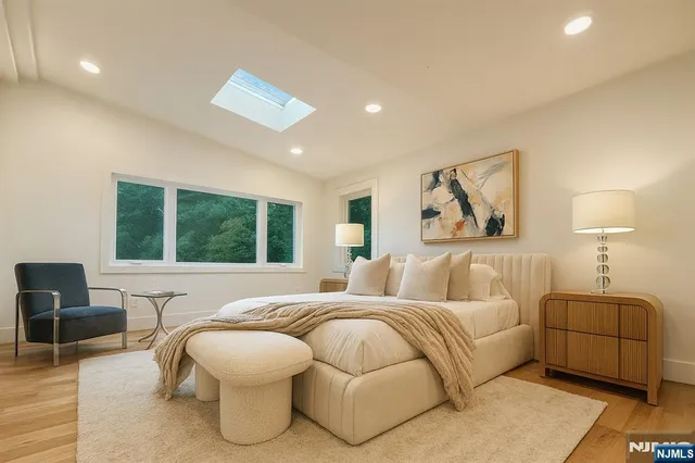 a bedroom with a bed and a couch